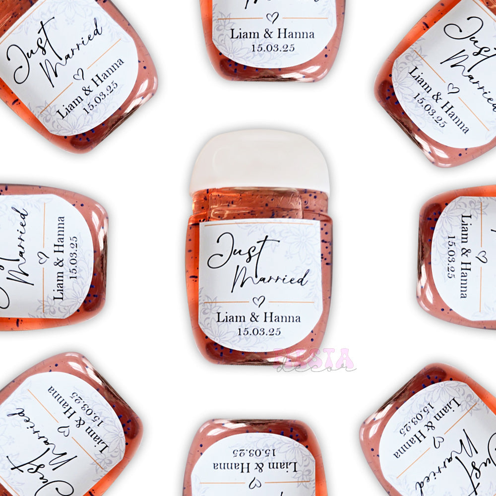 Personalized 'Just Married' wedding hand sanitizer favors with names, date, and pink speckled gel in clear bottles.
Custom wedding favors: Mini hand sanitizer bottles with elegant white labels and personalized details.
Wedding guest gifts: Pink speckled gel hand sanitizers with 'Just Married' custom labels for Liam & Hanna.