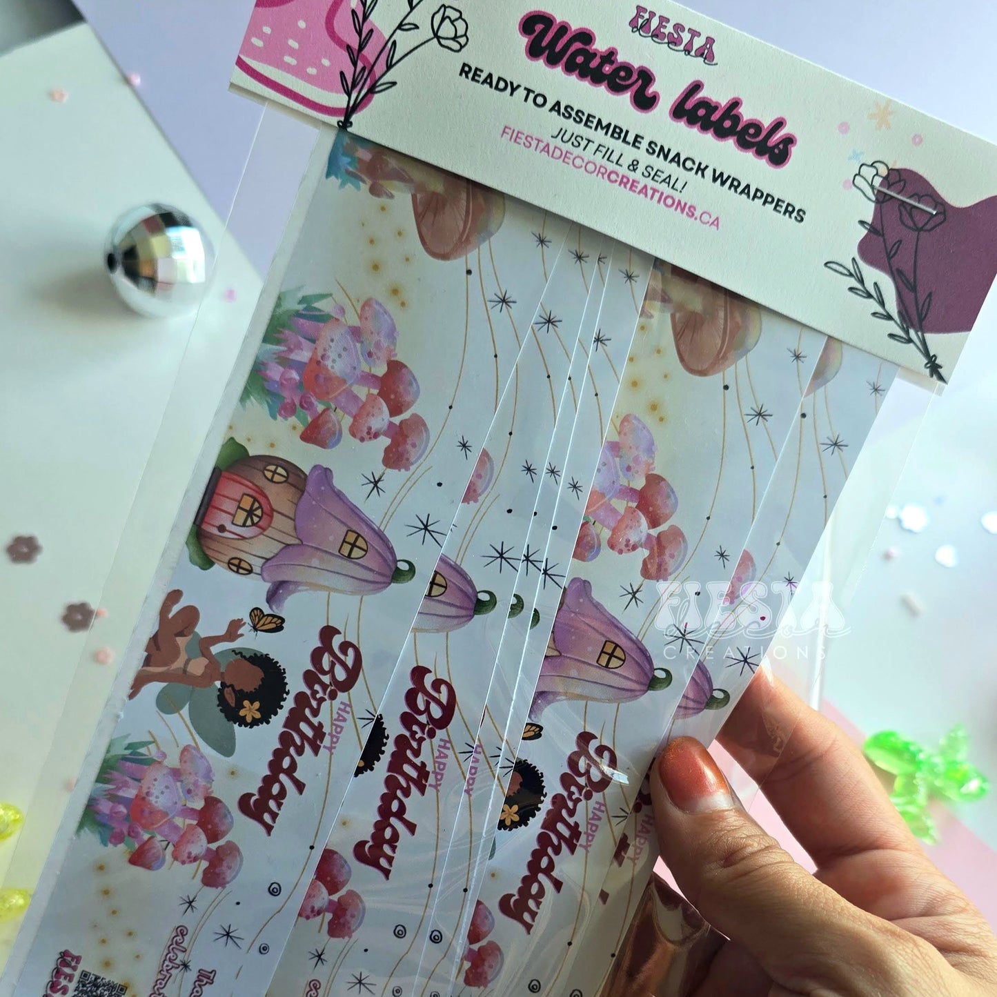 Customizable water bottle labels with a vibrant, glossy finish for any themed party or event, designed by Fiesta Decor Creations.
