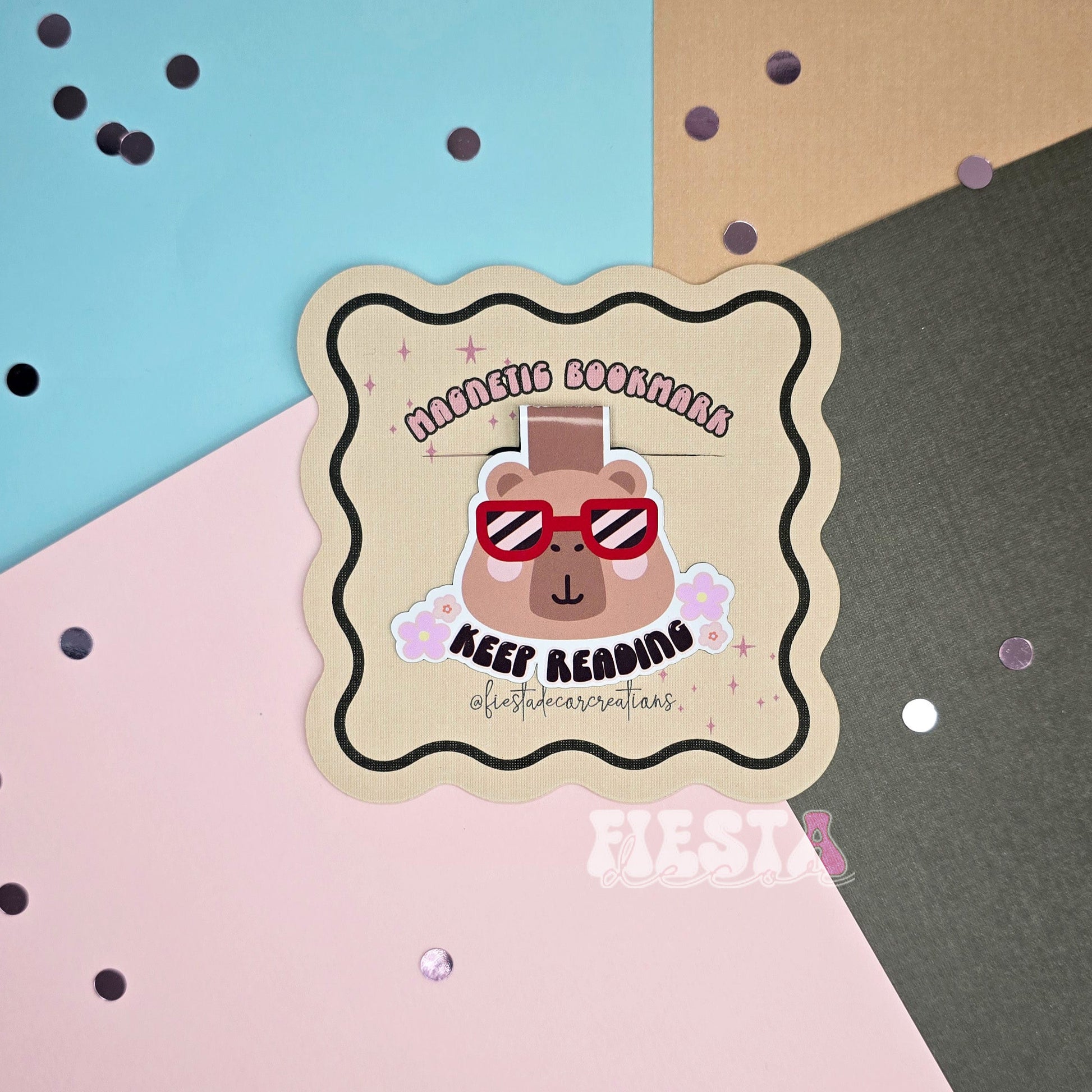 Whimsical personalized magnetic bookmark with a custom character or theme, "KEEP READING" text, and wavy edges.
Close-up of a personalized magnetic bookmark showcasing a custom character or theme with a "KEEP READING" phrase, perfect for book lovers.
Magnetic bookmark featuring a custom character or theme, personalized details, and a vibrant background.
