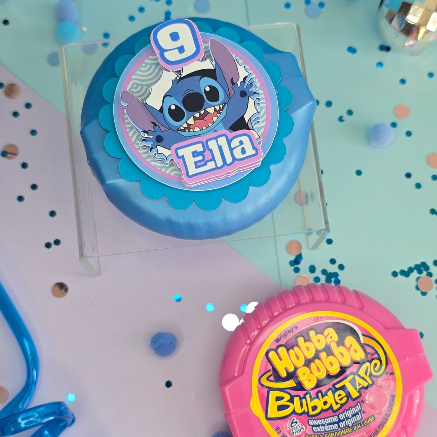 Personalized circular party favor on a stand, ideal for any themed celebration from Fiesta Decor Creations.