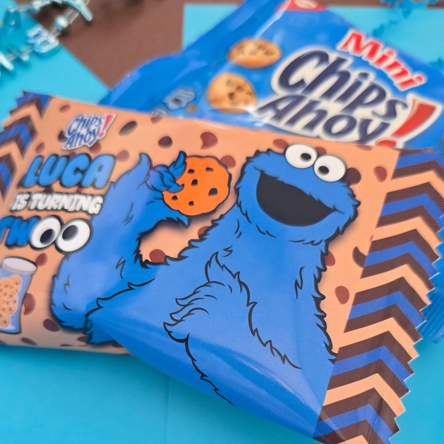 Personalized mini cookie wrapper with customizable text and character for a unique party favor, emphasizing custom design.