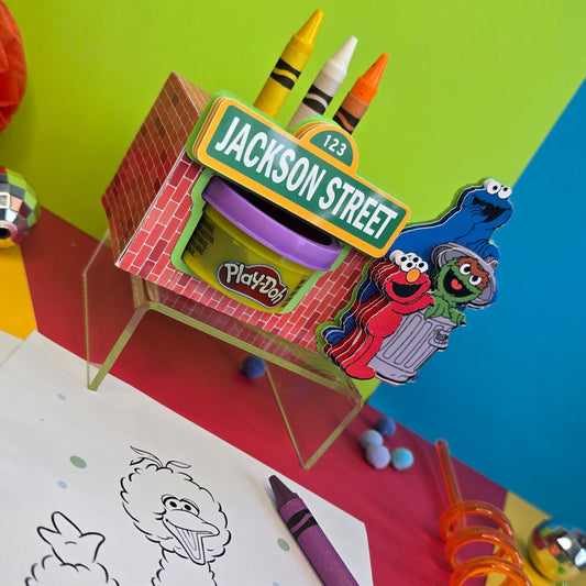 Customizable activity box featuring crayons, modeling compound, and a coloring page, perfect for personalized party favors.